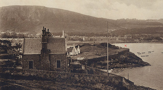 The Lammerlaws at Burntisland - the red cross is approximately where James Ewing fell from. You can just see people bathing at the foot of the rocks to give an idea of scale
